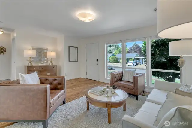 These windows are lovely to let the outside in. Large camellia bush outside is packed with color in the spring.