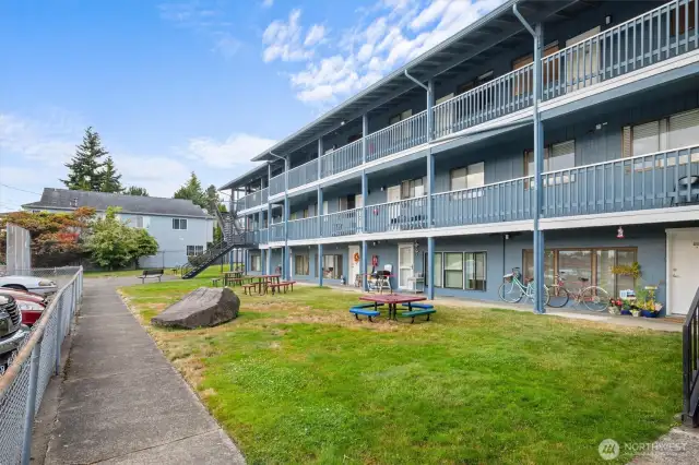 Great community area on back of building w/view of exterior deck.