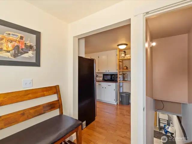 Kitchen leads to Laundry Room with a door to the lower level.
