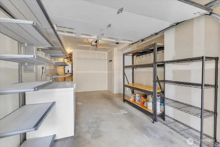 spacious garage! Shelving and freezer convey