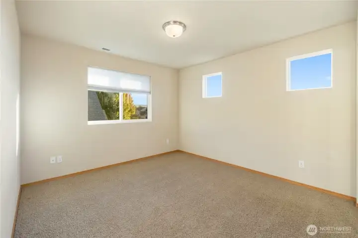 Upper-level guest bedroom