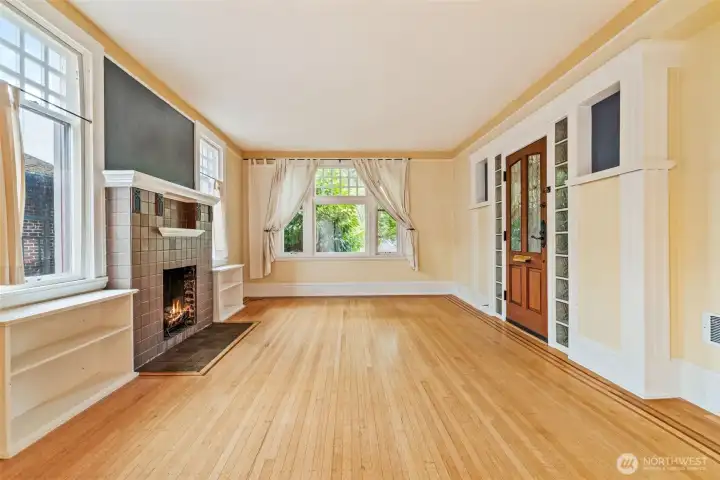 Elegant open-concept flow with ribbon inlaid hardwood floors and abundant natural light.