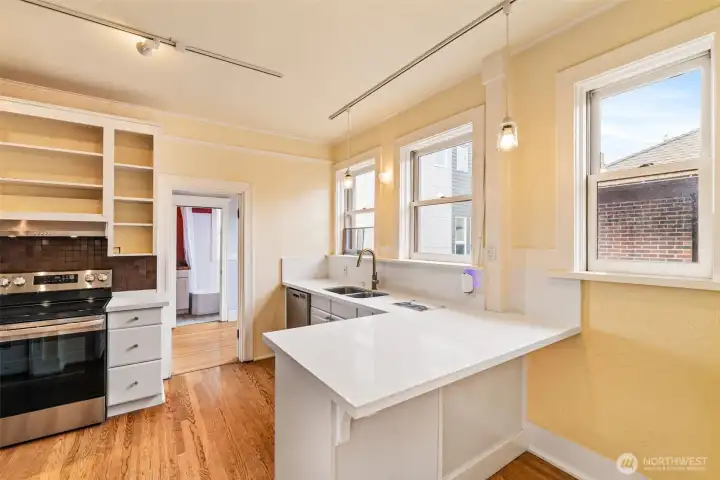 Bright and airy kitchen with modern updates, abundant natural light, and vintage charm.
