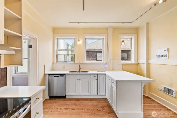 Sunlit kitchen with ample counter space and a classic layout that blends functionality with old-world style.