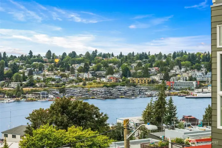 Sweeping outlook over the lake, marina, and surrounding hillside homes, giving the unit a strong visual appeal.