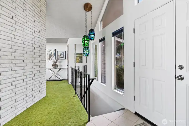 Or to the right for bedrooms or downstairs for the rec room. (That blue/green light fixture DOES NOT STAY.)