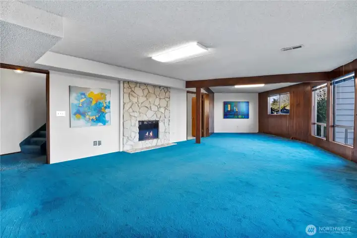 And downstairs to the rec room w/ cozy fireplace