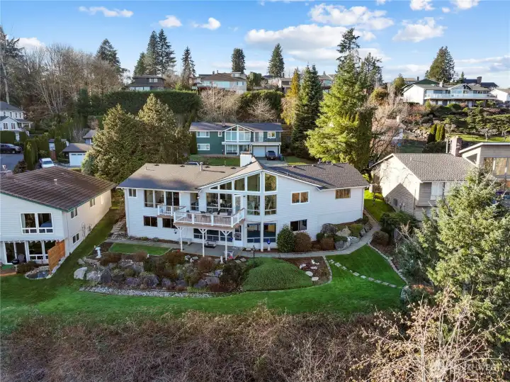 Over 12,000 sqft lot slopes downward so the view is captured