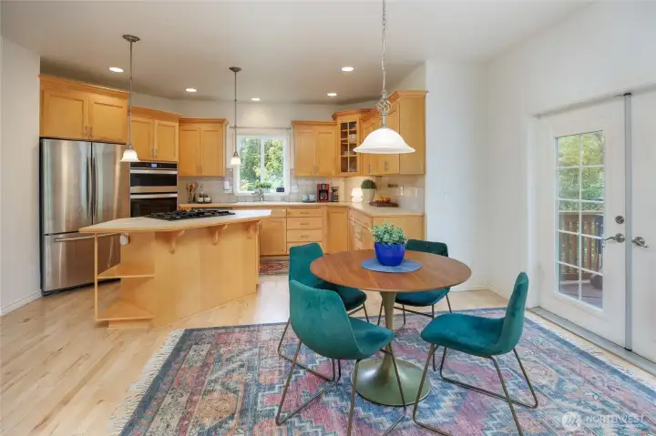 French doors lead to the BBQ deck & peaceful yard.