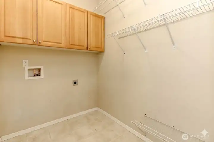 Laundry room w/cabinetry & shelving
