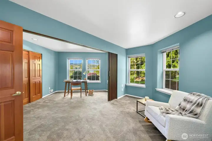 These two bedrooms have been opened up with an accordian door