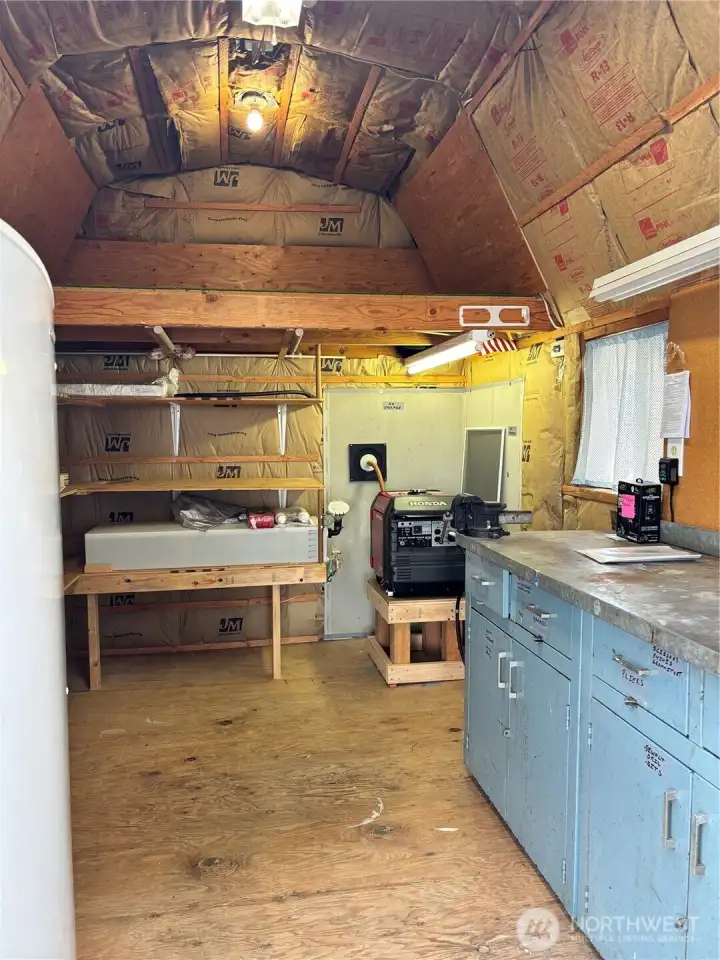 Generous shed that is insulated with power.  Freezer stays
