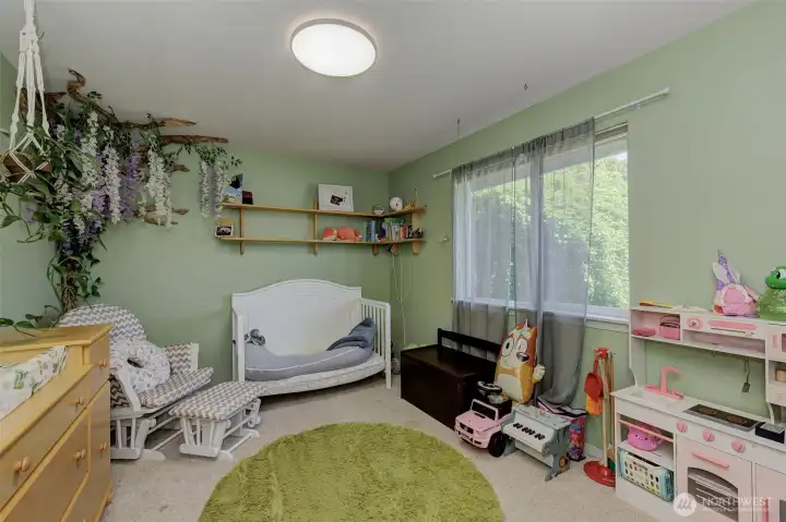 A guest room with views of the neighborhood.