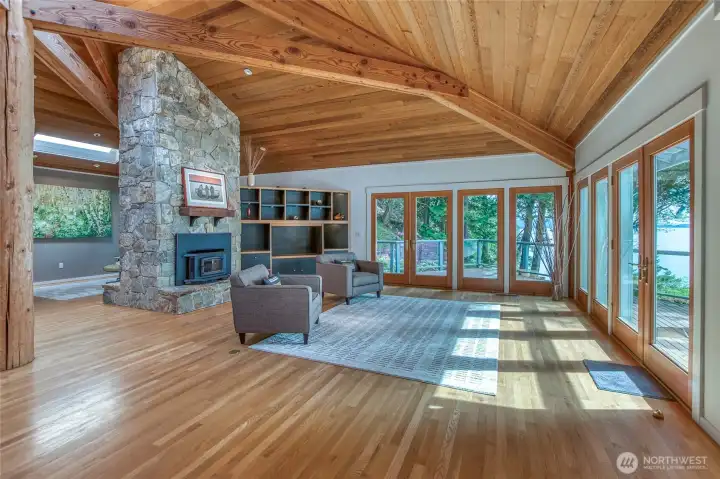 Living room featuring double-sided fireplace.