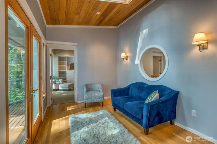 Hallway room from kitchen to primary bedroom. Use for office or flex space. Peek through the portal window.