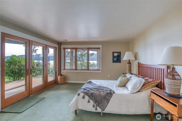 Guest suite #2 with access to private deck, yard, and access to beach. One of the best views in the house looking down East Sound!