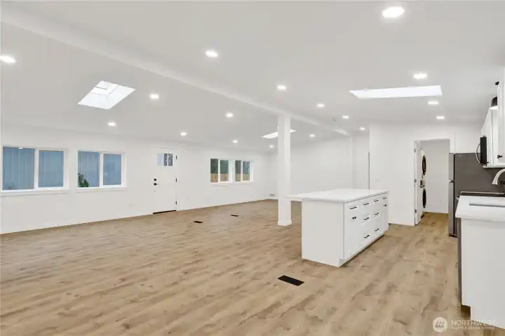 Spacious living area with skylights and natural light