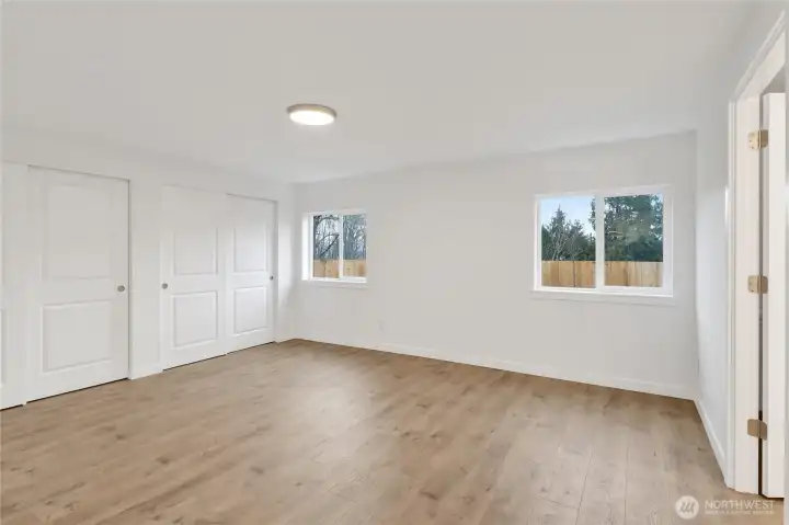 Primary suite features oversized layout with direct access to the en-suite bathroom.