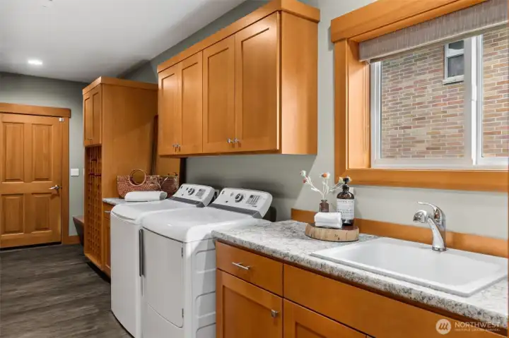 Sink in laundry room. Washer and dryer included