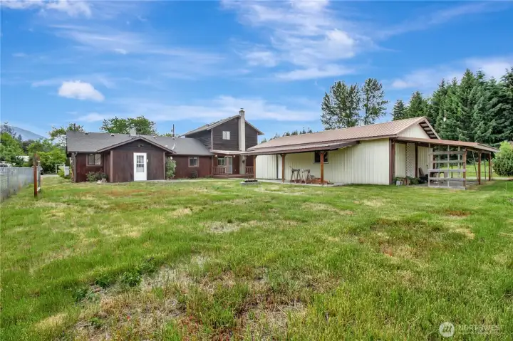 Shop and house with large back yard.