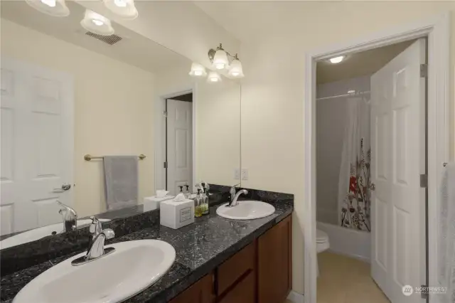Main Bathroom has double sinks and the whole wall is a mirror - you get to see everything!
