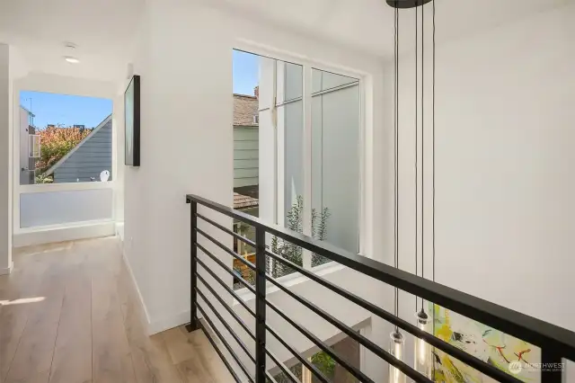 Hallway overlooks the dining area.