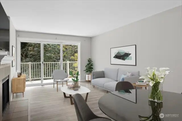 Living Room area w/ Wood Burning Fireplace and Large Balcony.