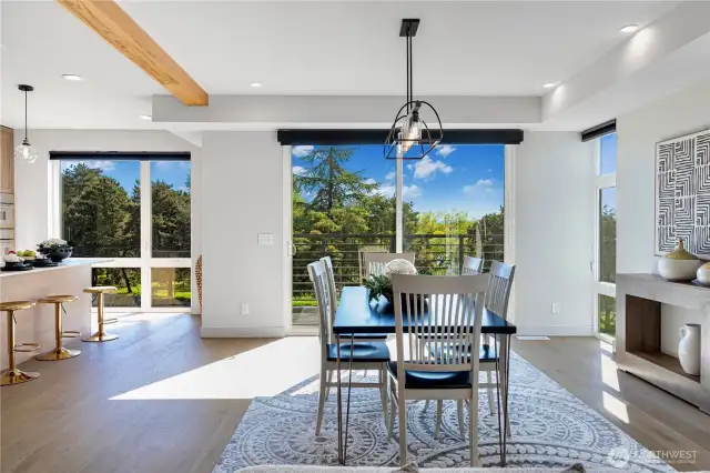 Dining area opens directly to the balcony for seamless indoor-outdoor living.