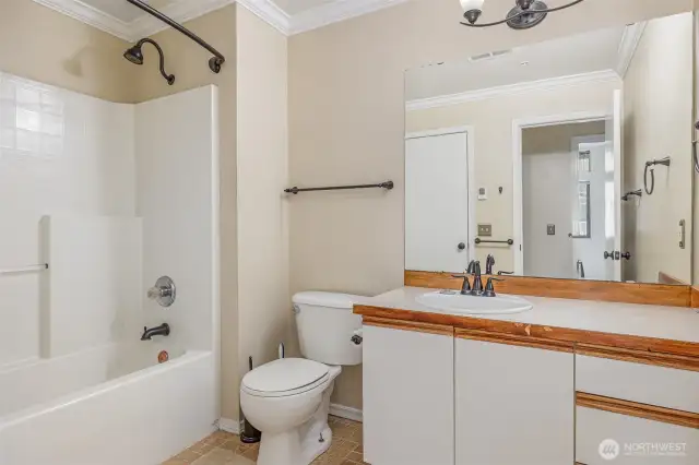Main bathroom with ample counterspace and neutral color palate.
