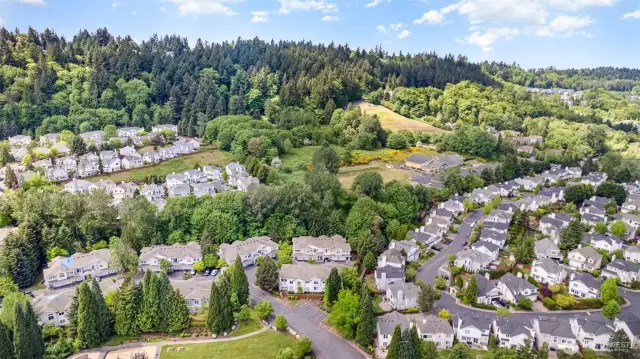 Stunning aerial view showcasing the full expanse of the property, highlighting its layout and surrounding beauty.
