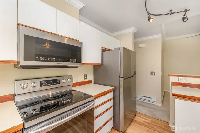 The kitchen is equipped with stainless steel appliances, combining style and functionality for all your culinary adventures.
