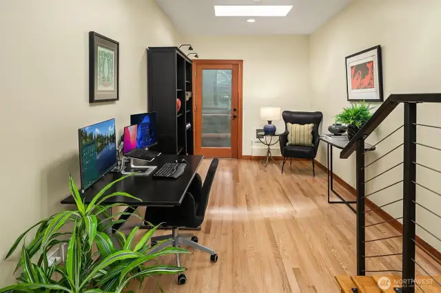 Large main floor office with sky lights to drench the space in rich sunshine.