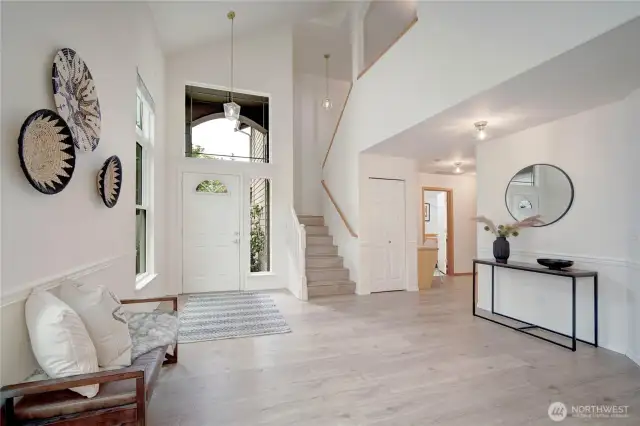 Soaring ceilings, fresh paint and modern updates throughout. The expansive windows flood the home with natural light, creating a cohesive flow throughout the open main level.