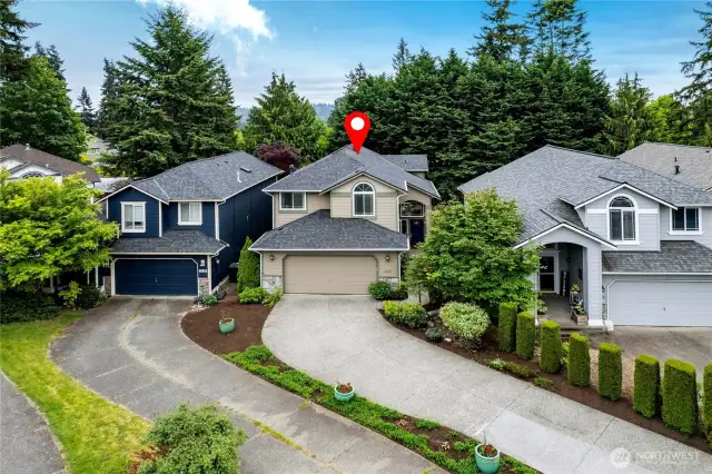 Fifth house in the cul-de-sac, set back against the trees. Private community playground just steps away. Over-sized 480 sq ft garage! Space for two vehicles, yard tools, storage, hobbies, and more. Bonus: Shelving and refriderator stay with home.