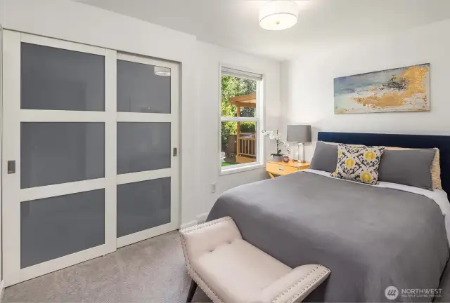 Each secondary bedroom is thoughtfully sized, providing versatility for guest quarters, a home office, or creative spaces. Bright windows and generous closets enhance comfort and functionality in every corner.