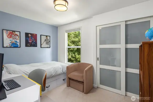 This upper-level room offers a peaceful retreat, featuring fresh paint, updated flooring, and ample closet space. Perfect for restful nights, productive days, or creative uses tailored to your needs.