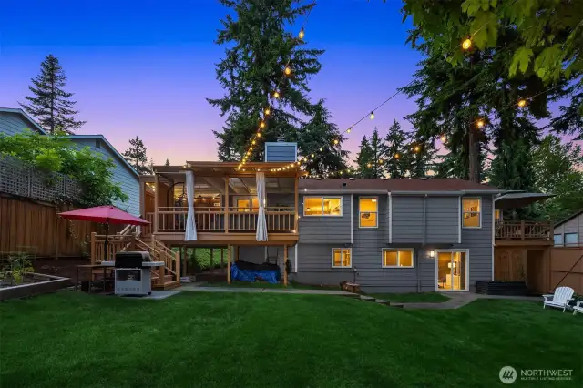 Beyond the balcony, enjoy a peaceful backyard sanctuary with lush planting beds, a small lawn, and a private patio. It’s the perfect outdoor extension of your living space—inviting and serene.