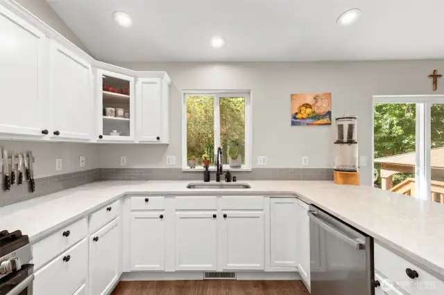 Quartz countertop with undermount sink.