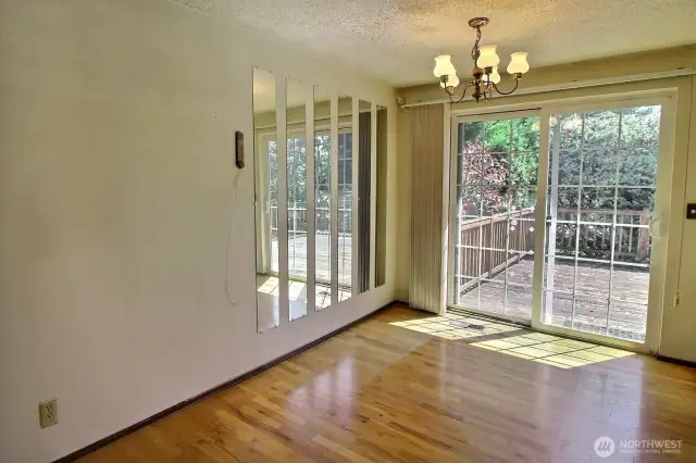 Dining space with slider to the huge backyard deck.