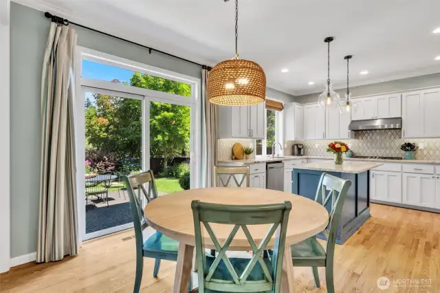 Large slider from the nook leads out to the garden patio.