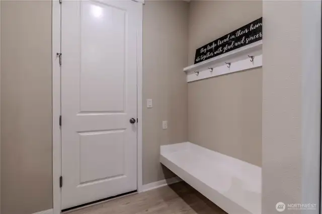 Garage door with coat rack and bench