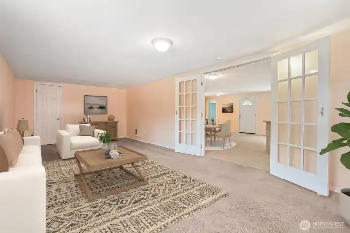 This angle shows the closet and the French doors with glass panels, a combo that makes the room feel complete. Close the doors and you get a solid sound barrier from kitchen clatter, while the carpet softens noise inside. Perfect setup for a media room or the third bedroom you’ve needed.