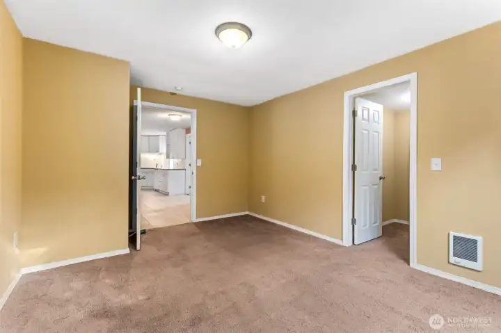 At about 14'x11', this bedroom proves it’s not the token “extra.” The scale works for a queen bed plus furniture, or skip the bed and call it your office, game room, or hobby space. Freshly painted walls keeps it clean, carpet keeps it grounded, and size keeps it useful.