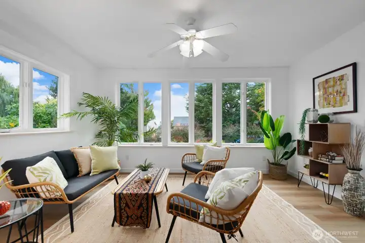 Charming sun porch expands the living area and offers peek views of the Sound and Olympics.
