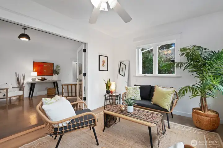 French doors open from the sun room into a generous living and dining room.