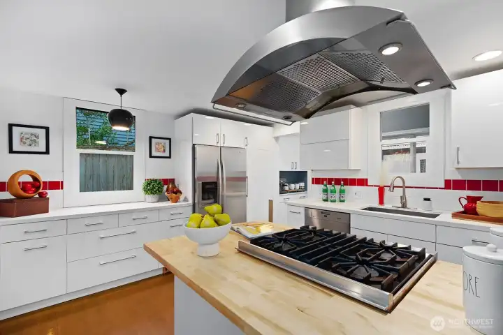 The kitchen has been recently updated with a butcher block counter. Plenty of cabinet space, Viking range, excellent lighting and good working space.