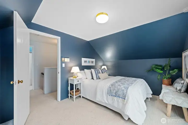 Upstairs, the largest of 3 bedrooms easily accommodates a queen bed and opens to a generous view deck.