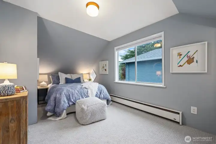 Second bedroom with big window, new carpet and a big closet.