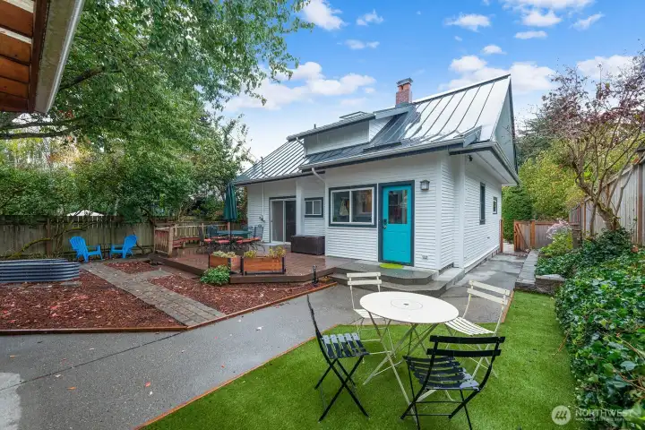 Low maintenance yard, big deck, planting beds and great areas to play, relax and entertain. Completely fenced!