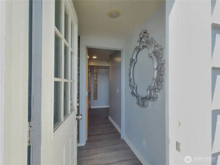 Designated lower level entrance adjacent to garage door.